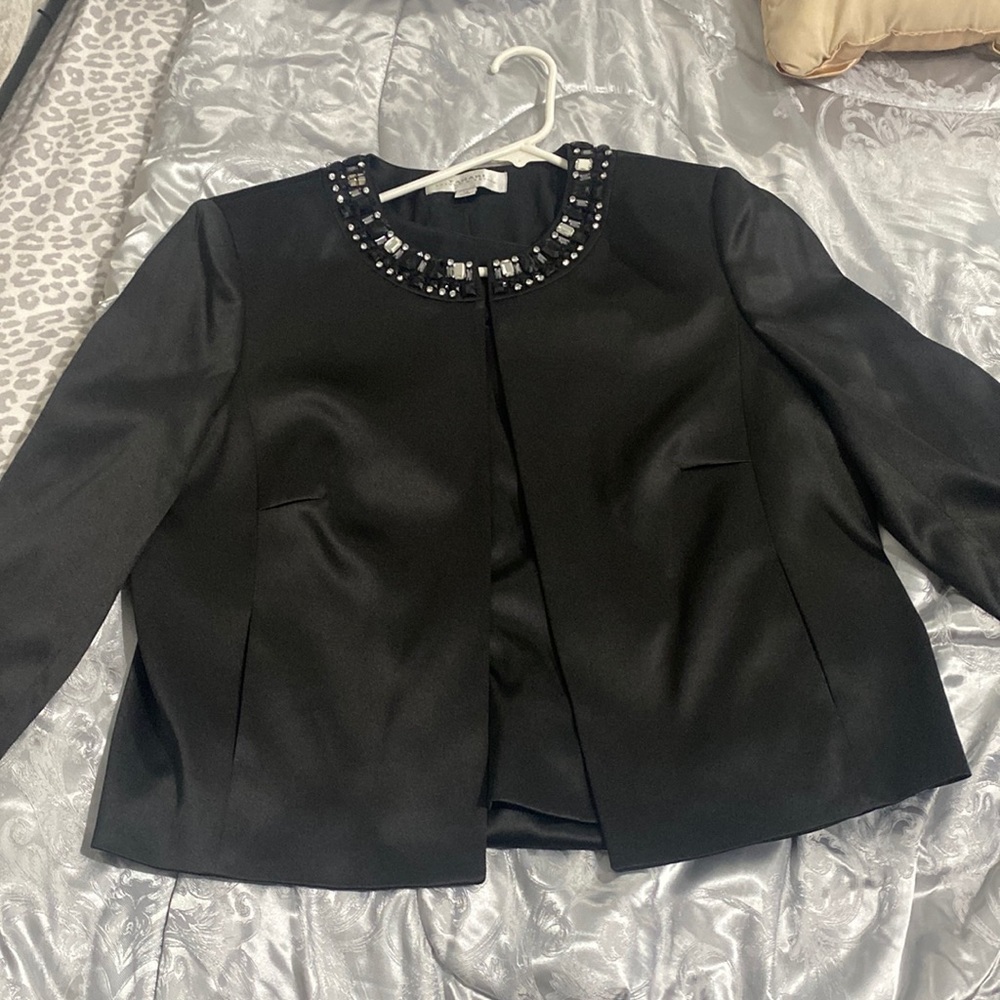 Suit jacket with black top with silver  gems around neck